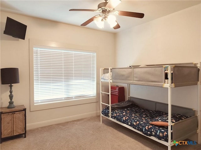 127 Augusta Dr, Wimberley, TX 78676 - carpeted bedroom with baseboards and ceiling fan