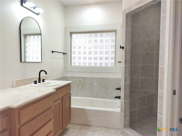 127 Augusta Dr, Wimberley, TX 78676 - full bath with tile patterned flooring, a tile shower, a bath, and vanity