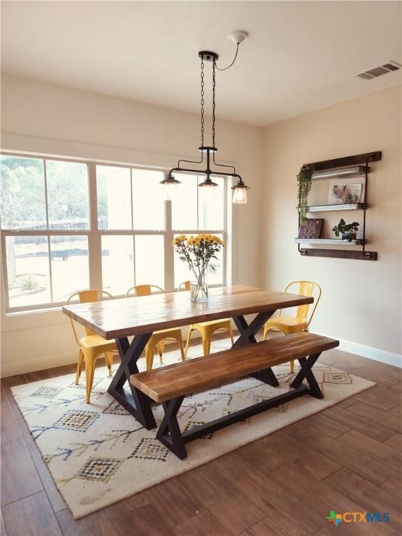 127 Augusta Dr, Wimberley, TX 78676 - dining room featuring baseboards and wood finished floors