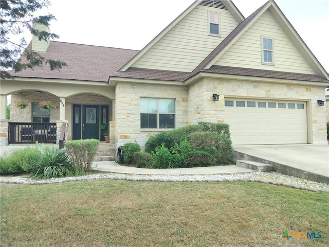 127 Augusta Dr, Wimberley, TX 78676 - view of front of property with stone siding, covered porch, roof with shingles, a chimney, and a front yard