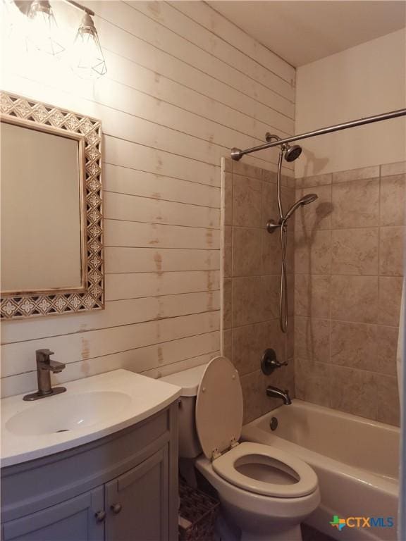 127 Augusta Dr, Wimberley, TX 78676 - full bathroom with toilet, vanity,  shower combination, and wooden walls