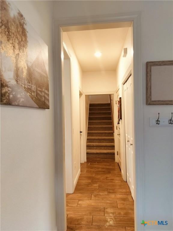 127 Augusta Dr, Wimberley, TX 78676 - hallway with light wood-style floors and stairway