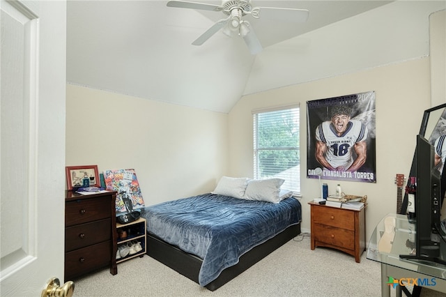 carpeted bedroom featuring lofted ceiling, a ceiling fan, and baseboards