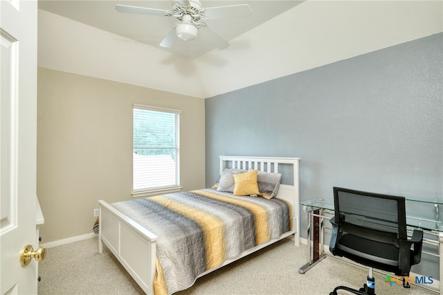 bedroom featuring a ceiling fan, lofted ceiling, carpet, and baseboards