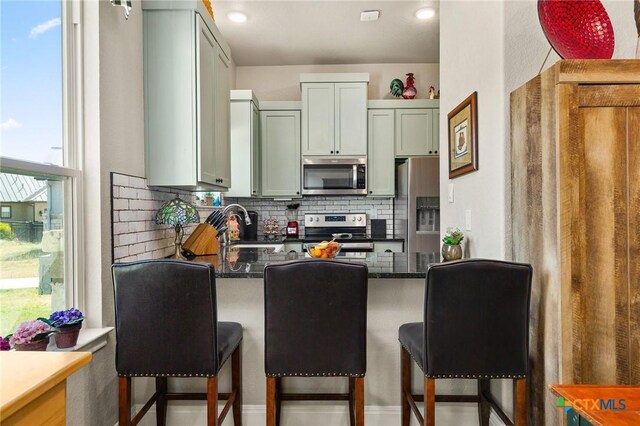 living area featuring light hardwood / wood-style flooring and ceiling fan