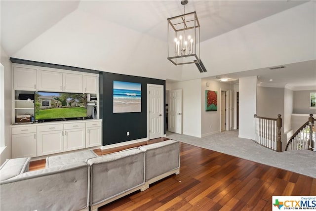 445 Champions Dr, Georgetown, TX 78628 - unfurnished living room with wood finished floors, high vaulted ceiling, a chandelier, and baseboards