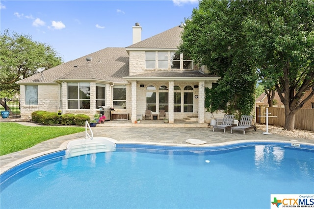 view of pool with a fenced in pool, a patio, and fence