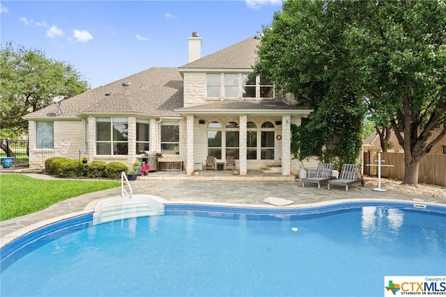 view of pool with a patio area, fence, and a fenced in pool