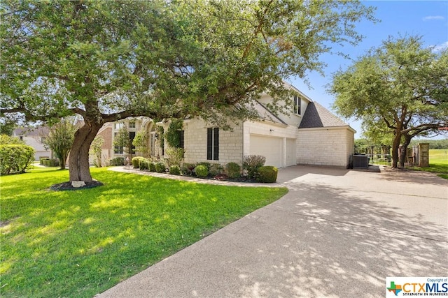 445 Champions Dr, Georgetown, TX 78628 - view of property hidden behind natural elements featuring driveway, a garage, and central AC unit