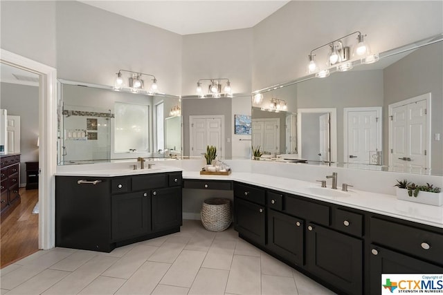445 Champions Dr, Georgetown, TX 78628 - full bathroom featuring a stall shower, vanity, and tile patterned floors