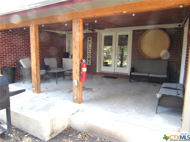 view of patio with ceiling fan, french doors, and an outdoor living space