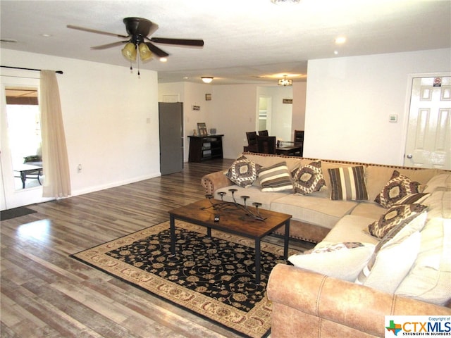 living room with hardwood / wood-style flooring and ceiling fan