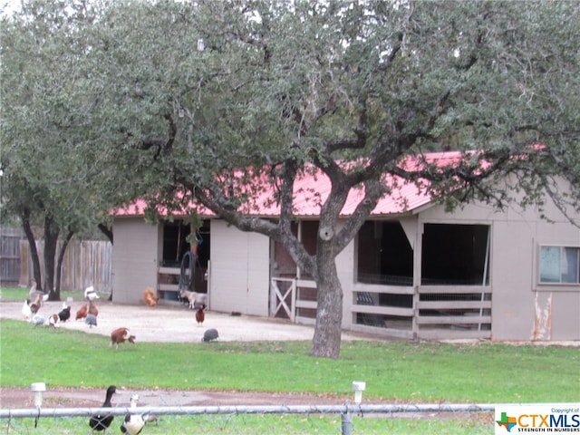 view of front facade featuring an outbuilding