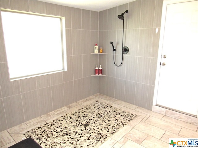 bathroom with tiled shower