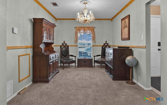 sitting room with visible vents, a notable chandelier, ornamental molding, carpet, and baseboards