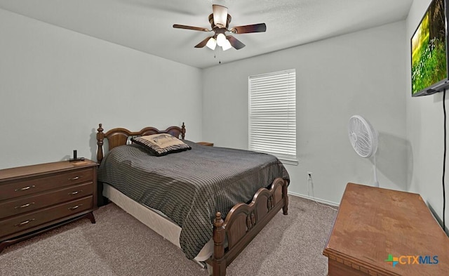 carpeted bedroom with a ceiling fan