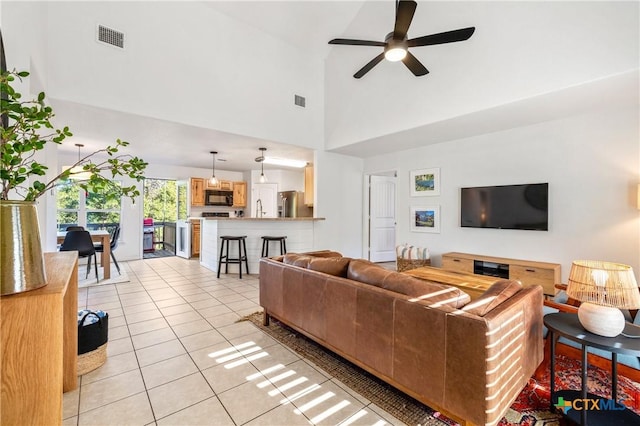 5445 Chimney Rock, Canyon Lake, TX 78133 - tiled living room featuring ceiling fan and a high ceiling