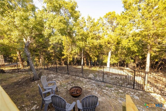 5445 Chimney Rock, Canyon Lake, TX 78133 - view of patio with an outdoor fire pit