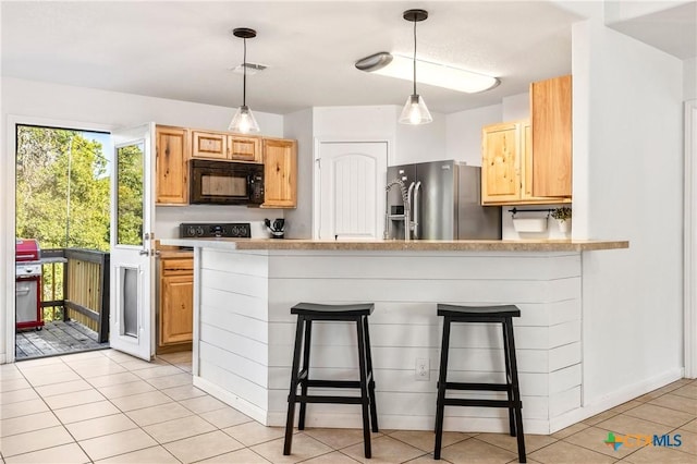 5445 Chimney Rock, Canyon Lake, TX 78133 - kitchen with stainless steel fridge, a breakfast bar area, kitchen peninsula, and light brown cabinets