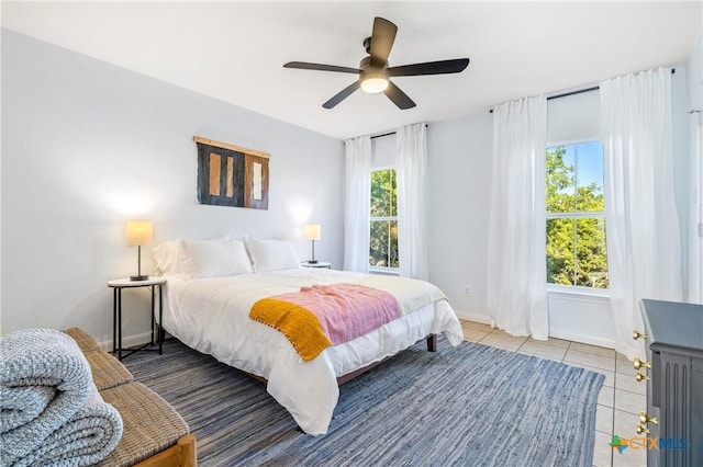 5445 Chimney Rock, Canyon Lake, TX 78133 - bedroom with multiple windows, tile patterned floors, and ceiling fan