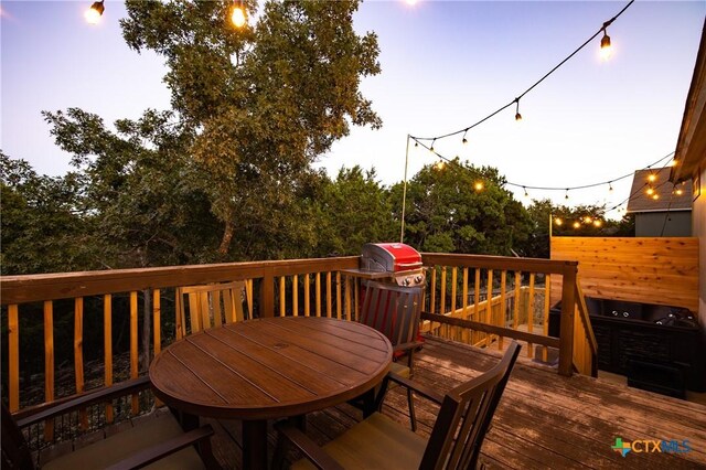 5445 Chimney Rock, Canyon Lake, TX 78133 - deck at dusk featuring a grill