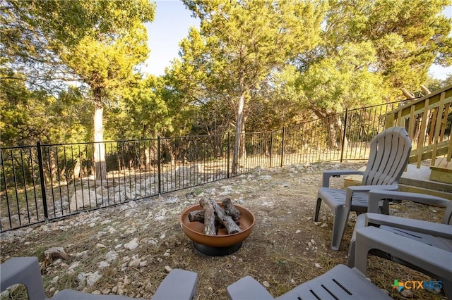 5445 Chimney Rock, Canyon Lake, TX 78133 - view of patio / terrace with an outdoor fire pit