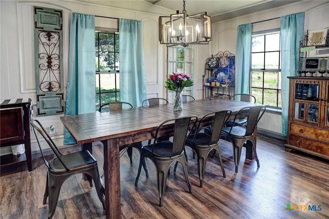 1319 County Road 339, Shiner, TX 77984 - dining space featuring a chandelier, wood finished floors, and healthy amount of natural light