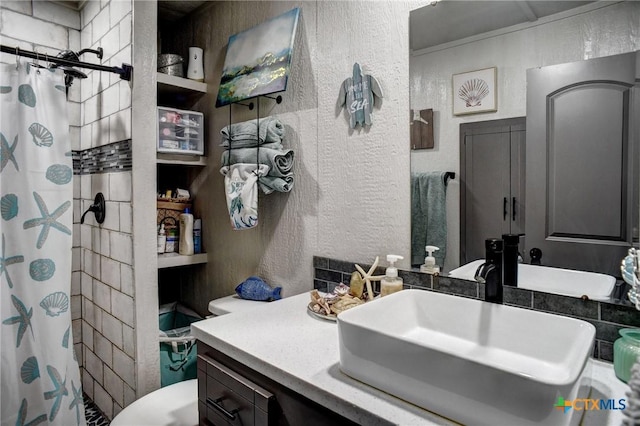 1319 County Road 339, Shiner, TX 77984 - full bath featuring a textured wall, curtained shower, vanity, and toilet