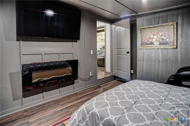 1319 County Road 339, Shiner, TX 77984 - bedroom featuring dark wood-style flooring