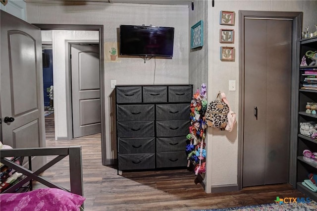 1319 County Road 339, Shiner, TX 77984 - bedroom with wood finished floors