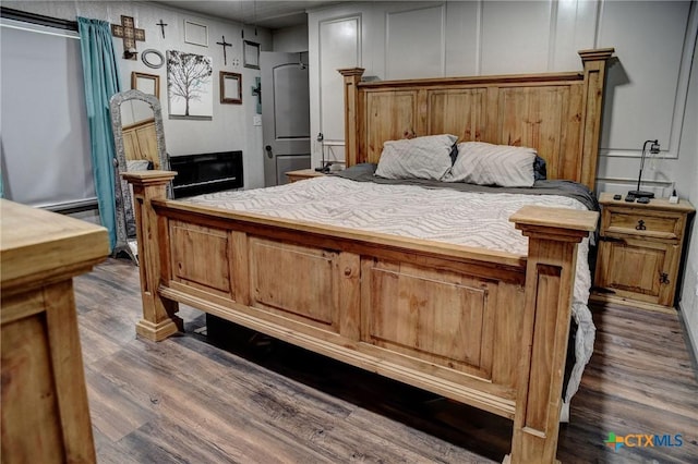 1319 County Road 339, Shiner, TX 77984 - bedroom featuring dark wood-style floors