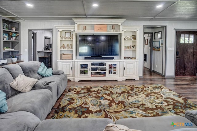 1319 County Road 339, Shiner, TX 77984 - living area with dark wood-type flooring, recessed lighting, and built in shelves