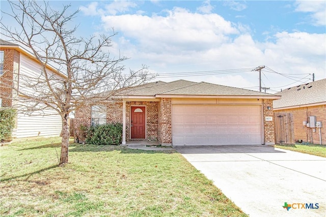 view of front of home with a front yard, brick siding, driveway, and an attached garage