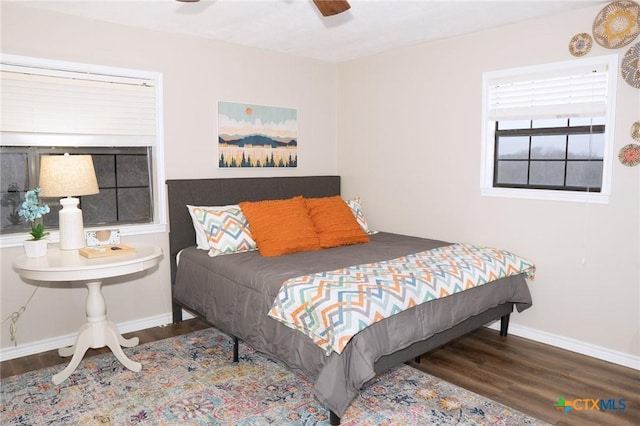 bedroom featuring wood-type flooring and ceiling fan