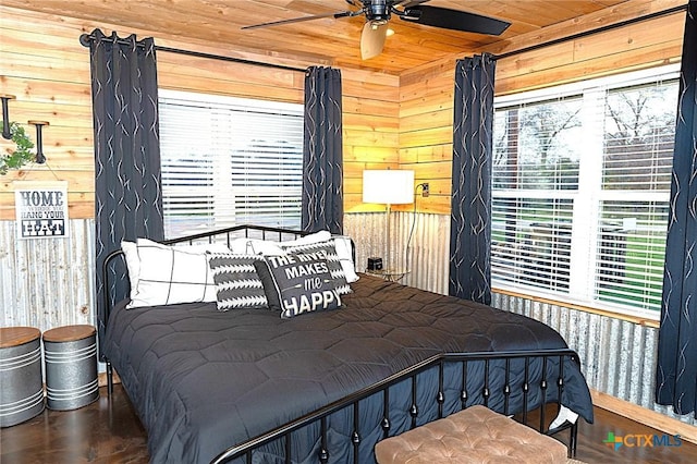 bedroom with wood ceiling, wood-type flooring, and wood walls