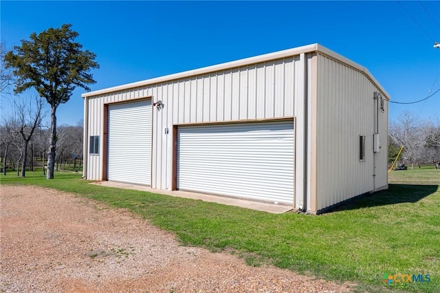 garage with a lawn