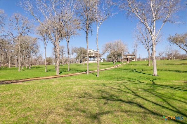 view of home's community featuring a yard