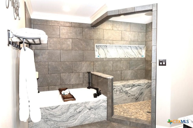 bathroom featuring crown molding and separate shower and tub