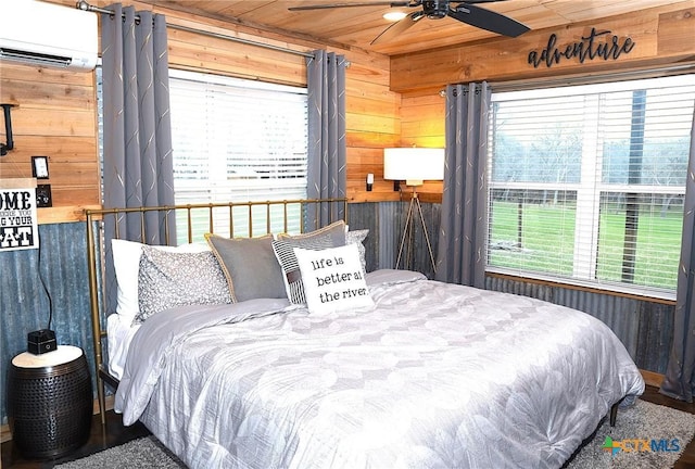 bedroom featuring a wall mounted AC, wooden ceiling, ceiling fan, and wood walls