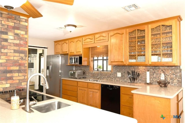 kitchen featuring tasteful backsplash, stainless steel appliances, and sink