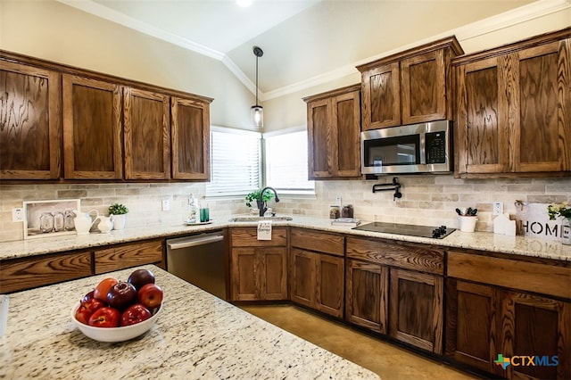 kitchen with light stone counters, stainless steel appliances, decorative backsplash, sink, and vaulted ceiling