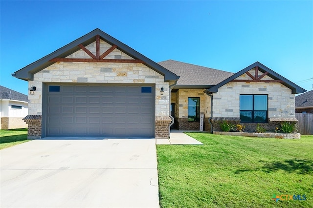 craftsman-style home featuring a front lawn and a garage