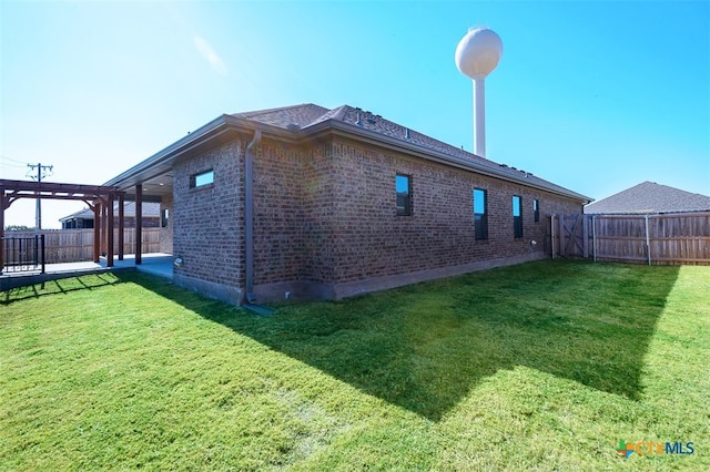 view of home's exterior with a lawn