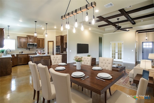 dining space featuring coffered ceiling, beam ceiling, ceiling fan, and crown molding