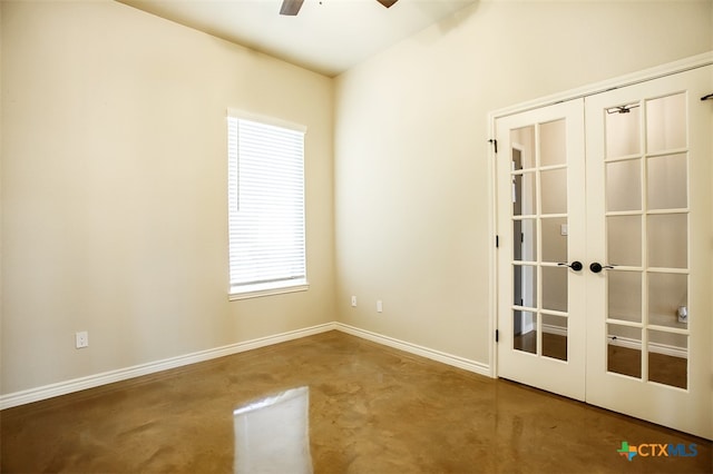 empty room featuring carpet flooring, french doors, and ceiling fan