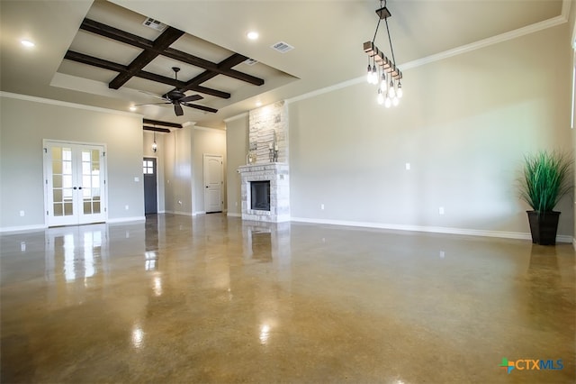 unfurnished living room featuring a fireplace, ceiling fan, crown molding, and coffered ceiling