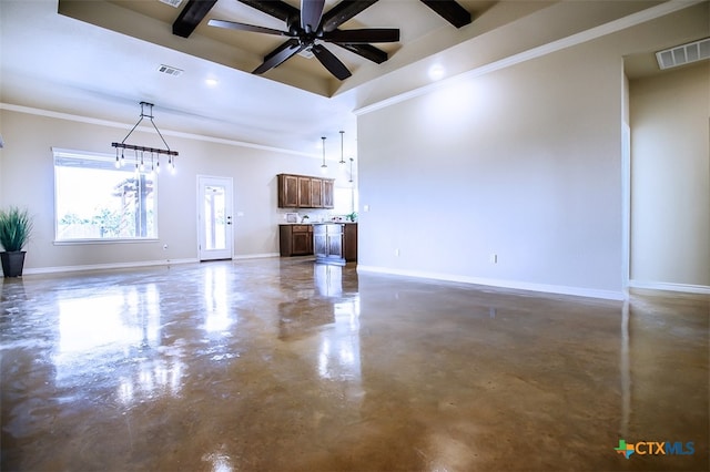 unfurnished living room featuring ceiling fan with notable chandelier and ornamental molding