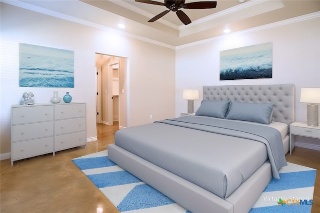 bedroom with ornamental molding, ceiling fan, and a tray ceiling