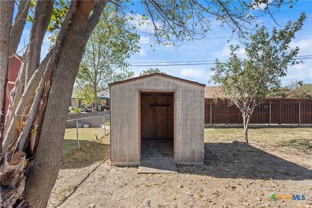 view of outbuilding featuring a yard