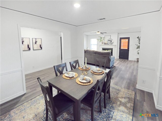 empty room featuring light hardwood / wood-style floors, a textured ceiling, and ornamental molding